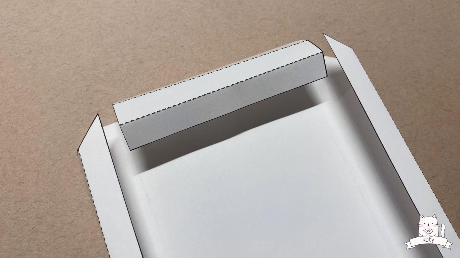 Scoring fold lines on paper frame